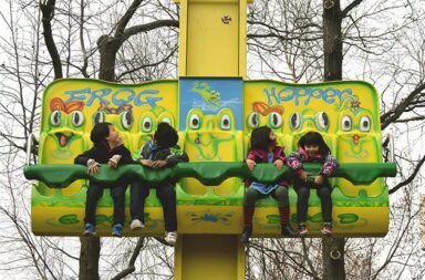 children-in-frog-hopper-drop-tower-ride