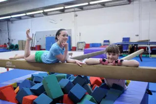 girls on balance beam