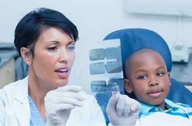 dentist-showing-boy-x-rays