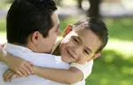 Dad and Son Embrace