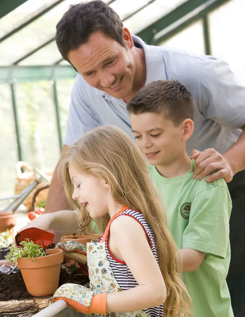 family in greenhouse