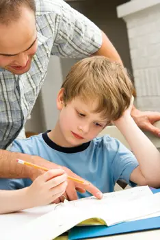 father tries to help son with homework; math homework