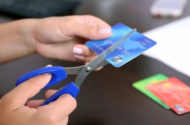 female-cutting-credit-card