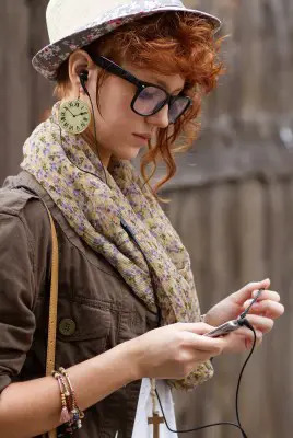 female teen wearing headphones