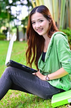 female teen with computer