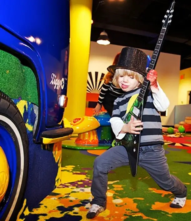 young boy rocking out on guitar