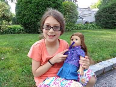 girl-brushing-american-girl-doll-teeth