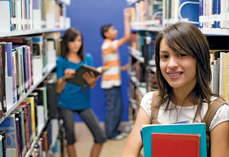 middle school girl in library