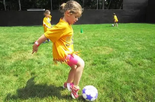 girl playing soccer