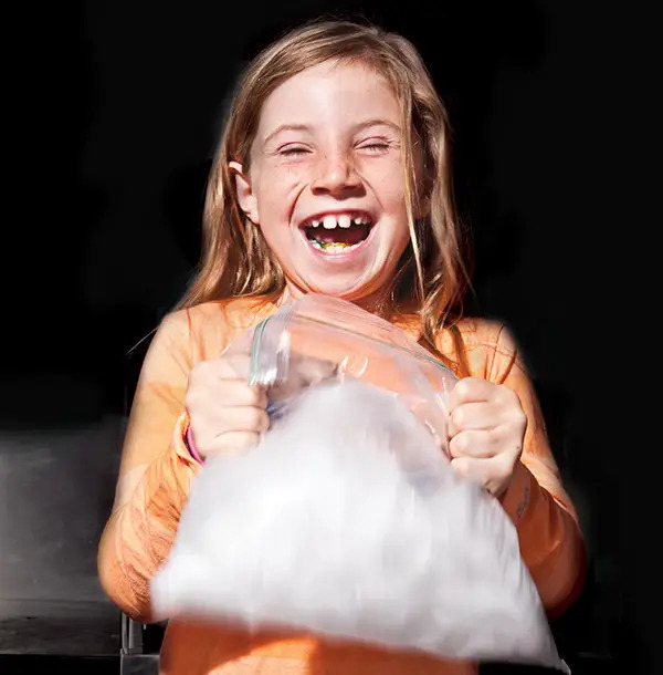 girl shaking homemade ice cream