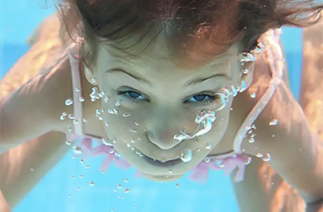 girl swimming underwater