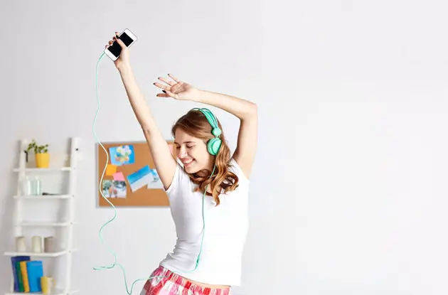 teen girl dancing listening to music