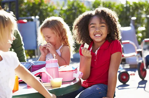 girls eating lunch at school