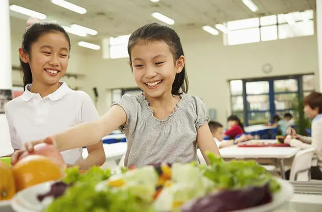 girls choosing school lunch