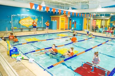 goldfish-indoor-swim-school-children-swimming-adults-observing