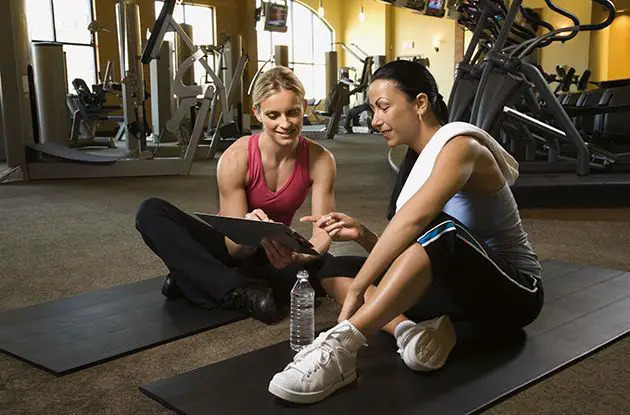 women sitting at the gym