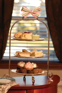 high tea tray with sweets and scones