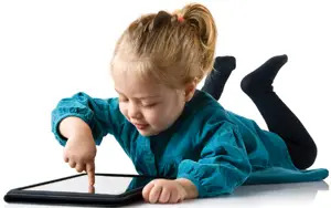 Little Child Playing with iPad Tablet