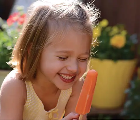 girl eating popsicle