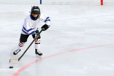 boy playing hockey