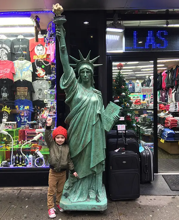 kid with statue of liberty