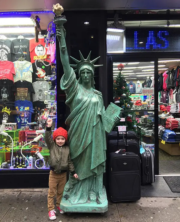 kid with statue of liberty