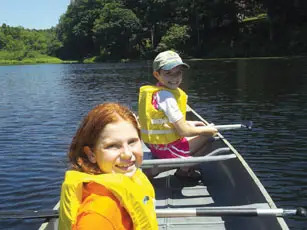 two campers in a canoe