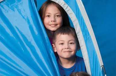 kids-peeking-out-of-tent