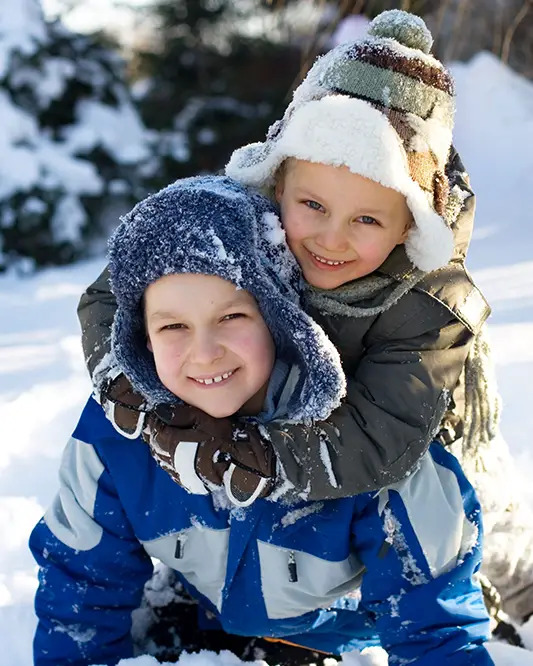 kids sledding in winter