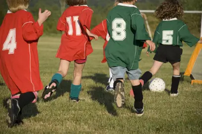 children playing soccer