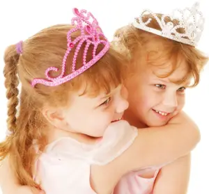 two young girls, sisters, wearing princess crowns; two little princesses