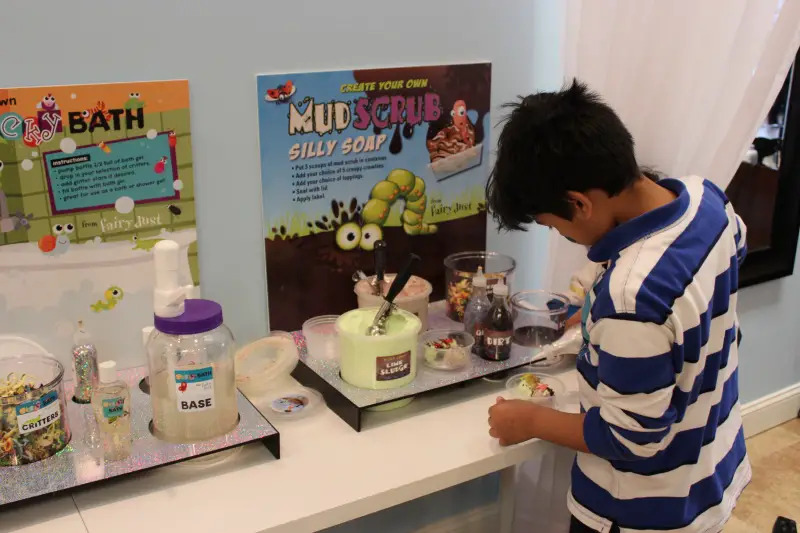 boy making mud scrub soap