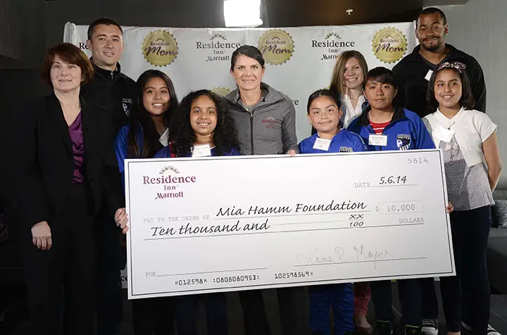 mia hamm with check from residence inn