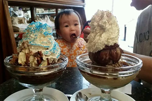 toddler girl eating ice cream