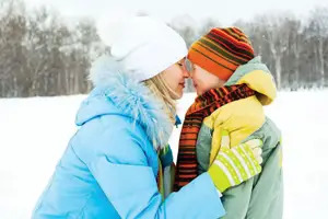 mom and son outside in the winter; bundled up