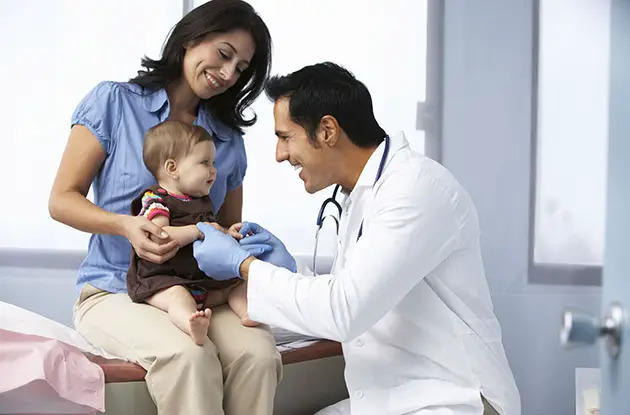 mom with baby and pediatrician