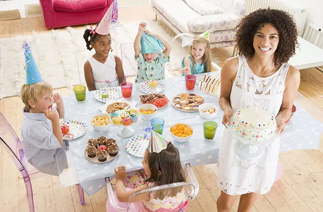 mom with kids at birthday party