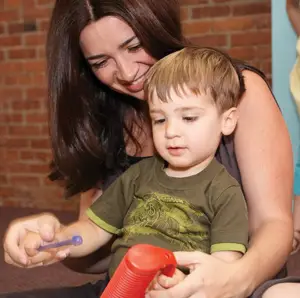 mommy and me music class; mom and son making music