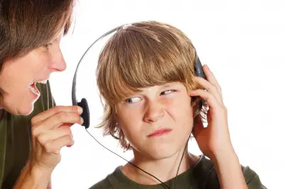 mom yelling at son wearing headphones