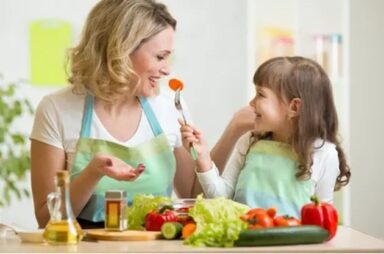 mother-daughter-eating-vegetables