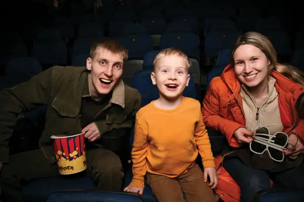 family in movie theater