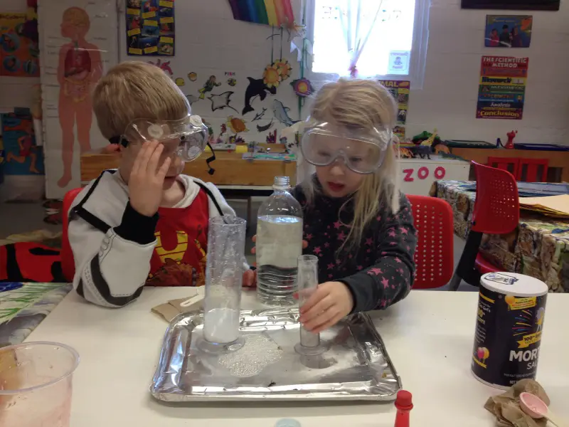 children doing science experiment