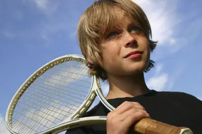 nervous boy with tennis racquet