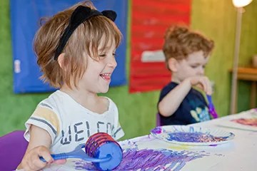 children painging at ny kids club