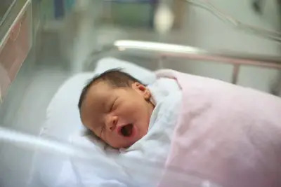 newborn infant girl sleeping