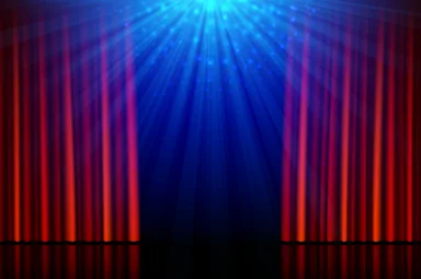 Stage with red opening curtains and spotlights