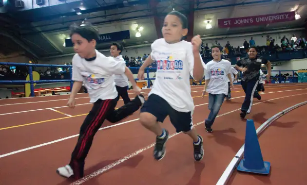 kids run track at the nyrr youth jamboree in nyc