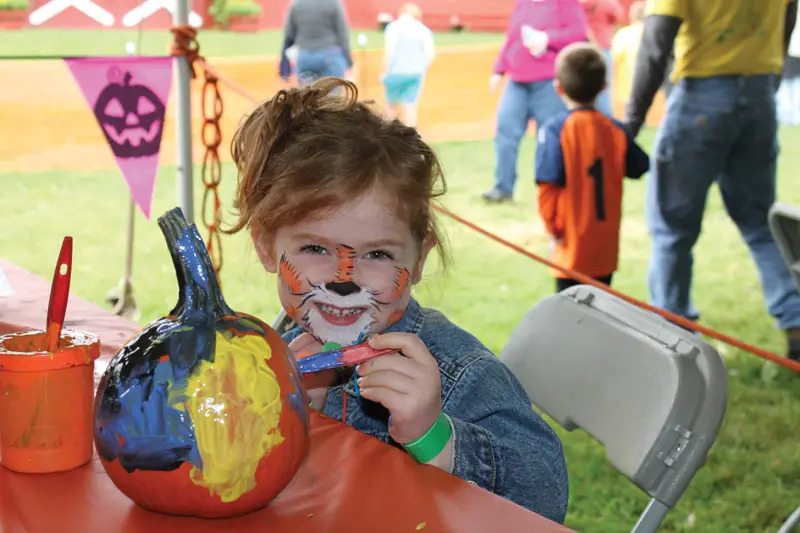 painting pumpkins at fall festival