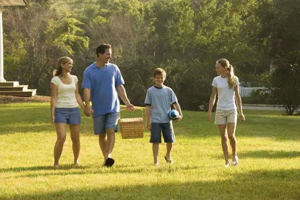 Parents connecting with preteens at the park