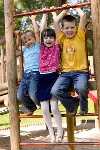 children on a playground; jungle gym